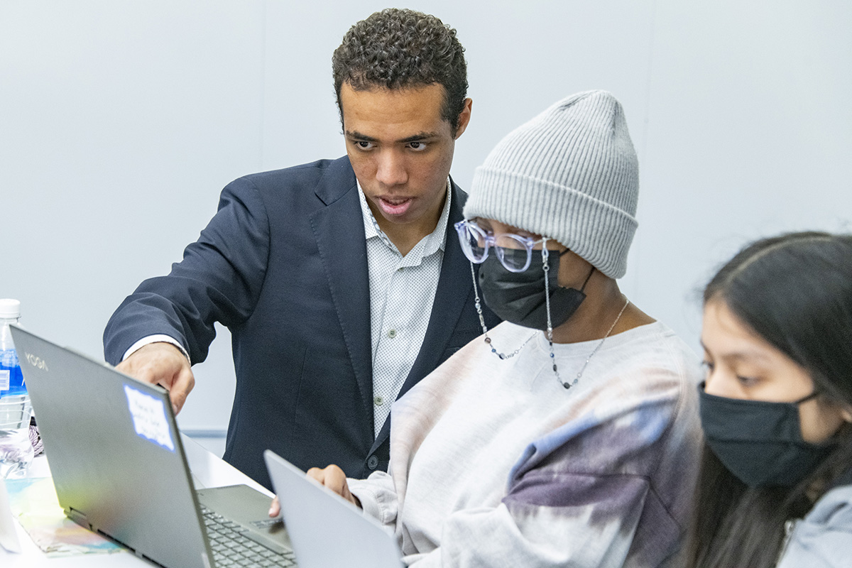 Doug Williams, who double-majors in data science and public policy at the College, mentors high schoolers in his small group.