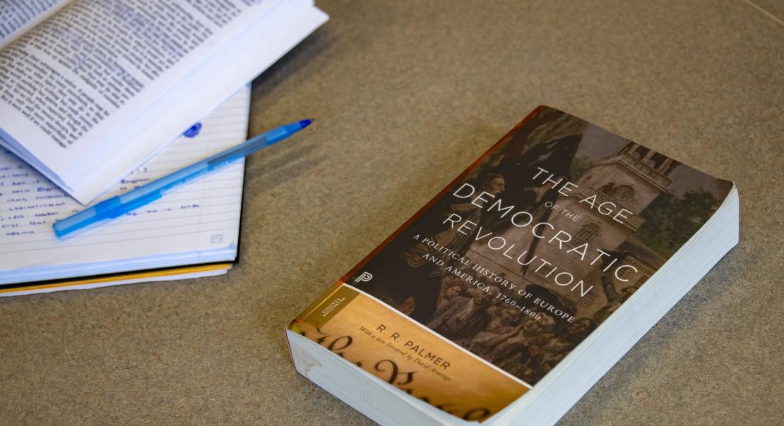 Book, Notebook, and Pen on a Desk