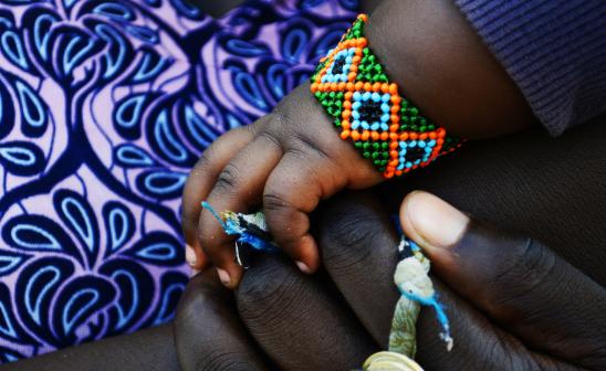 child's hands in mothers' hands