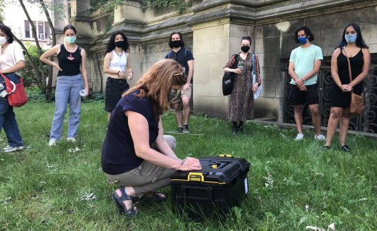 Prof Shannon Lee Dawdy putting final touches on time capsule for her class