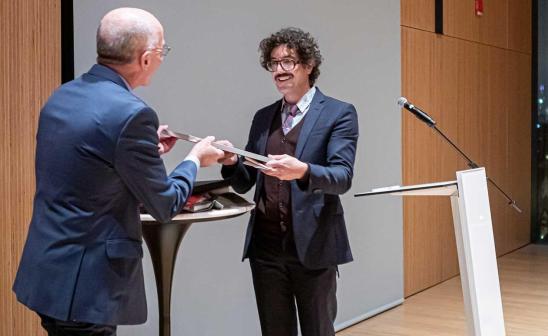 Michael Rossi accepting award