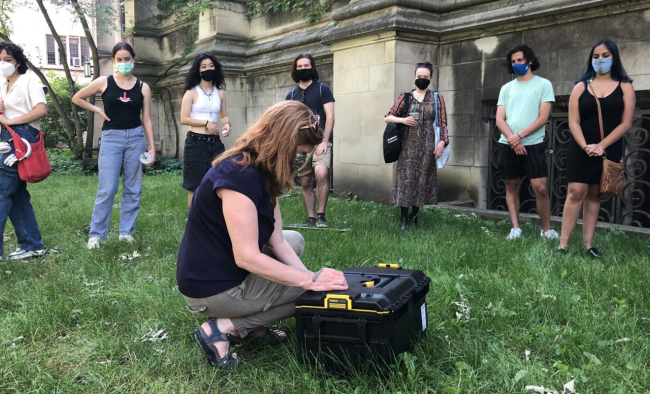 Prof Shannon Lee Dawdy putting final touches on time capsule for her class