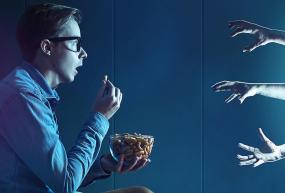 man watching horror movie
