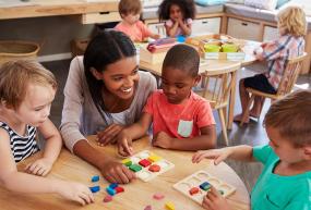 young children and teacher in classroom