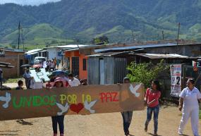 Community members of La Ciudadela in Florencia, Caquetá, Colombia organize a march to support peacebuilding efforts in the Fall of 2015.