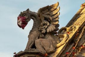 gargoyle wearing a cloth mask